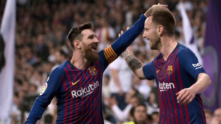 Lionel Messi and Ivan Rakitic celebrate Barcelona's opener at Real Madrid