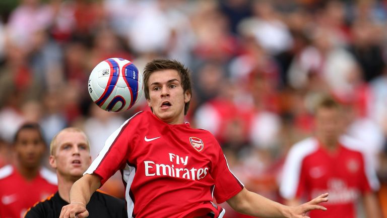 Aaron Ramsey of Arsenal contests the ball while Barnet's Neal Bishop looks on in a pre-season match between Barnet and Arsenal at Underhill on July 19, 2008 in London, United Kingdom.