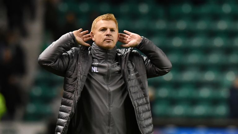 Celtic manager Neil Lennon celebrates in front of the fans at full time