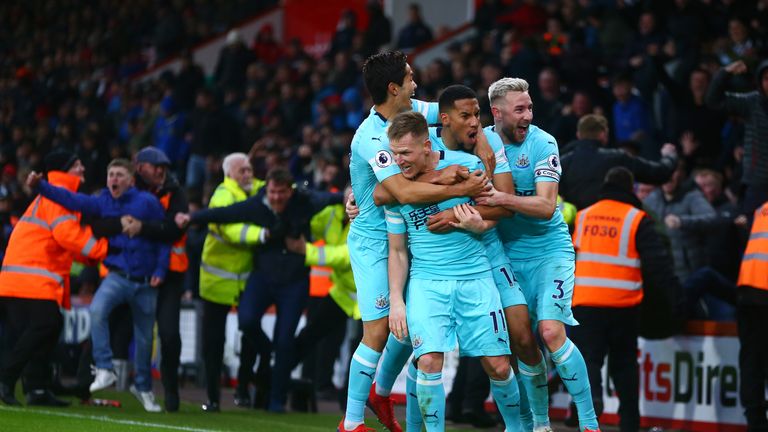 Matt Ritchie celebrates after scoring Newcastle's second goal with his team-mates
