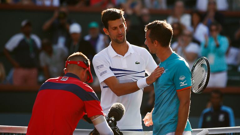 Novak Djokovic of Serbia congratulates Philipp Kohlschreiber of Germany on his men’s singles third round victory on Day 9 of the BNP Paribas Open at the Indian Wells Tennis Garden on March 12, 2019 in Indian Wells, California