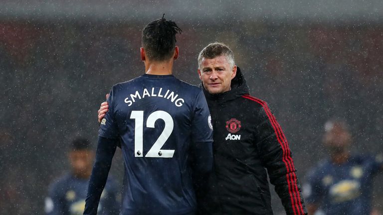 Ole Gunnar Solskjaer with Chris Smalling after defeat to Arsenal