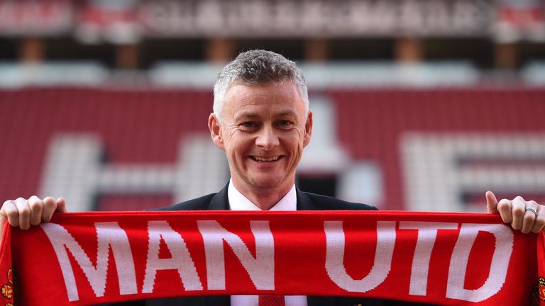 Ole Gunnar Solskjaer poses at Old Trafford after it was announced that he was appointed as the clubs full-time manager on a three-year contract
