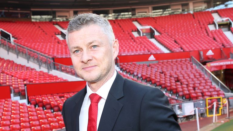 Ole Gunnar Solskjaer is seen during a photo call at Old Trafford after it was announced that he was appointed as the clubs full-time manager on a three-year contract