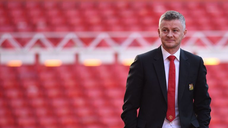 Ole Gunnar Solskjaer is seen during a photo call at Old Trafford after it was announced that he was appointed as the clubs full-time manager on a three-year contract