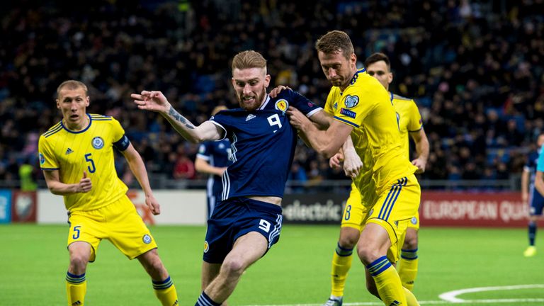 Scotland&#39;s Oli McBurnie (L) competes with Kazakhstan&#39;s Serhiy Malyi.