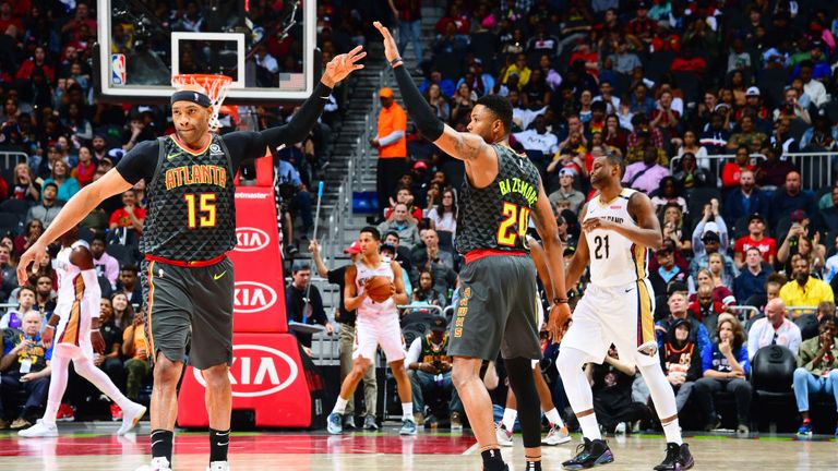 Vince Carter  and Kent Bazemore of the Atlanta Hawks celebrate during the game against the New Orleans Pelicans