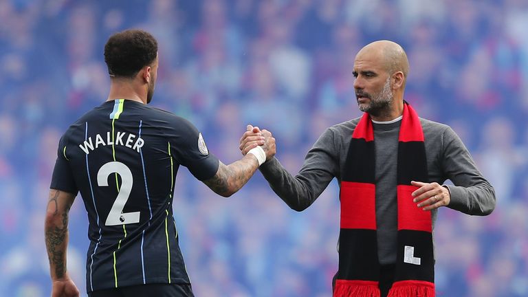 Pep Guardiola shakes hands with Kyle Walker following the 2-0 win over Fulham at Craven Cottage