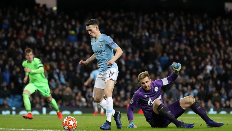 Manchester City's Phil Foden rounds Schalke goalkeeper Ralf Fahrmann to score his side's sixth goal of the game during the UEFA Champions League round of 16 second leg match at the Etihad Stadium, Manchester. PRESS ASSOCIATION Photo. Picture date: Tuesday March 12, 2019. See PA story SOCCER Man City. Photo credit should read: Martin Rickett/PA Wire