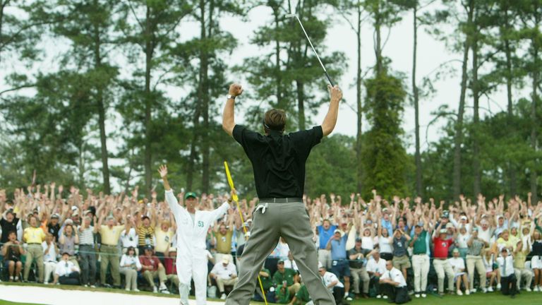 Phil Mickelson of the USA jumps in the air after his birdie to wins the 2004 Masters by one shot on the 18th green 