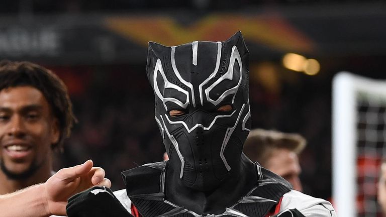 Pierre-Emerick Aubameyang celebrates in a Black Panther mask after scoring Arsenal's third goal in last night's UEFA Europa League Round of 16, Second Leg between Arsenal and Rennes