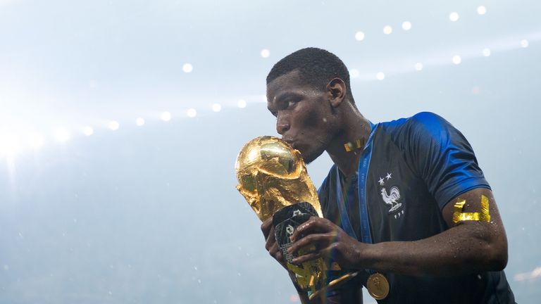Paul Pogba kisses the World Cup trophy after France beat Croatia in the final