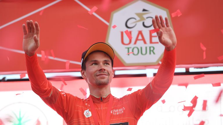 Primoz Roglic celebrates in the leader's red jersey at the UAE Tour