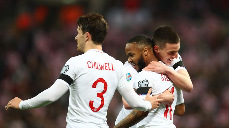 Raheem Sterling of England celebrates as he scores his team's fourth goal and completes his hat trick with Ben Chilwell and Declan Rice during the 2020 UEFA European Championships Group A qualifying match between England and Czech Republic at Wembley Stadium on March 22, 2019 in London, United Kingdom.