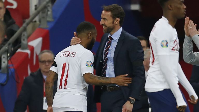 England manager Gareth Southgate (R) congratulates England's midfielder Raheem Sterling after substituting him during the UEFA Euro 2020 Group A qualification football match between England and Czech Replublic at Wembley Stadium in London on March 22, 201