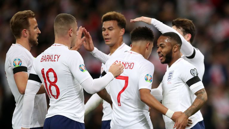 England's Raheem Sterling (right) celebrates scoring his side's first goal of the game during the UEFA Euro 2020 Qualifying, Group A match at Wembley Stadium, London