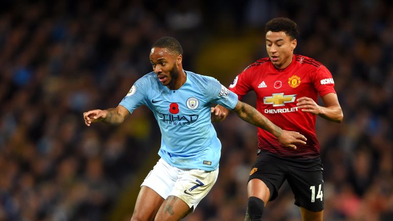 Raheem Sterling looks to get away from Jesse Lingard during the Manchester derby at the Etihad Stadium