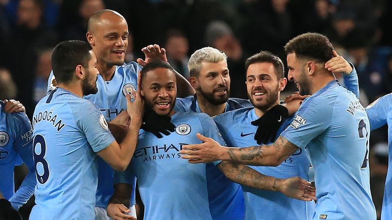 Raheem Sterling celebrates his opener with Man City team-mates