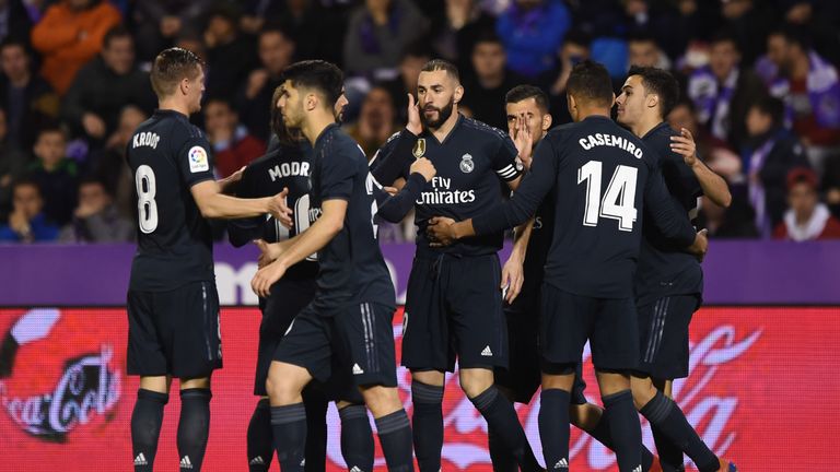 Karim Benzema celebrates scoring with his team-mates