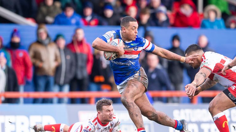 Wakefield's Reece Lyne evades the tackle of Hull KR's Josh Drinkwater & Weller Hauraki