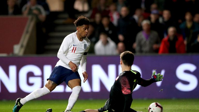 Reiss Nelson goes past Poland U21  goalkeeper Kamil Grabara