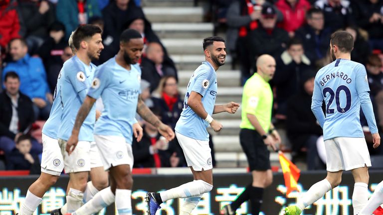 Riyad Mahrez celebrates with team-mates after putting Manchester City ahead