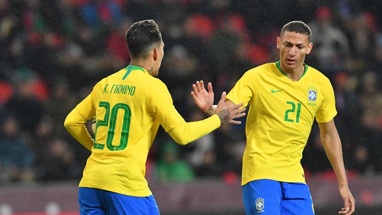 Roberto Firmino celebrates scoring Brazil's equaliser against Czech Republic with team-mate Richarlison