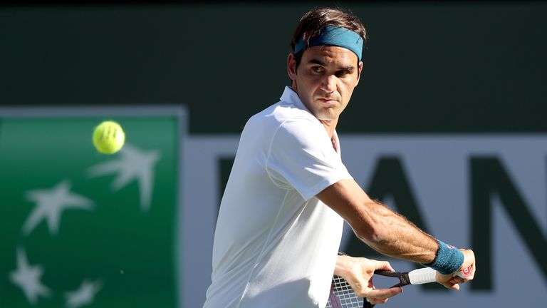 Roger Federer of Switzerland returns a shot to Dominic Thiem of Austria during the men's final of the BNP Paribas Open at the Indian Wells Tennis Garden on March 17, 2019 in Indian Wells, California.