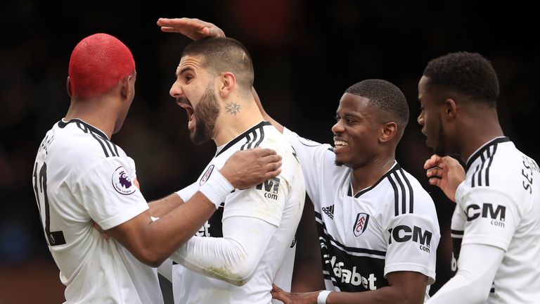 Ryan Babel and Aleksandar Mitrovic celebrate Fulham's equaliser against Liverpool at Craven Cottage