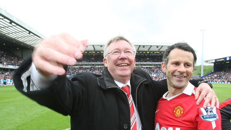 Sir Alex Ferguson and Ryan Giggs of Manchester United celebrate winning the Premier League title after the Barclays Premier League match between Blackburn Rovers and Manchester United at Ewood Park on May 14, 2011 in Blackburn, England.