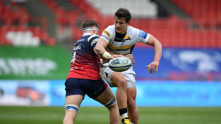 Worcester's  Ryan Mills looks to offload the ball out of the tackle from Ed Holmes