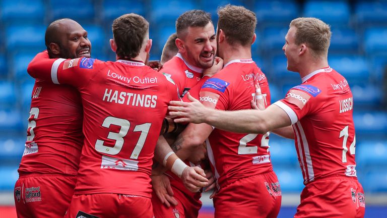 Picture by Alex Whitehead/SWpix.com - 24/03/2019 - Rugby League - Betfred Super League - Salford Red Devils v Wigan Warriors - AJ Bell Stadium, Salford, England - Salford's Adam Walker (centre) celebrates his try with team-mates.