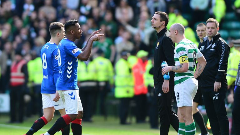 Brown smiles as Morelos makes his way off the pitch in the Old Firm clash