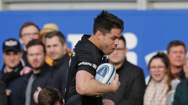 Sean Maitland of Saracens is tackled by Fraser Dingwall of Northampton