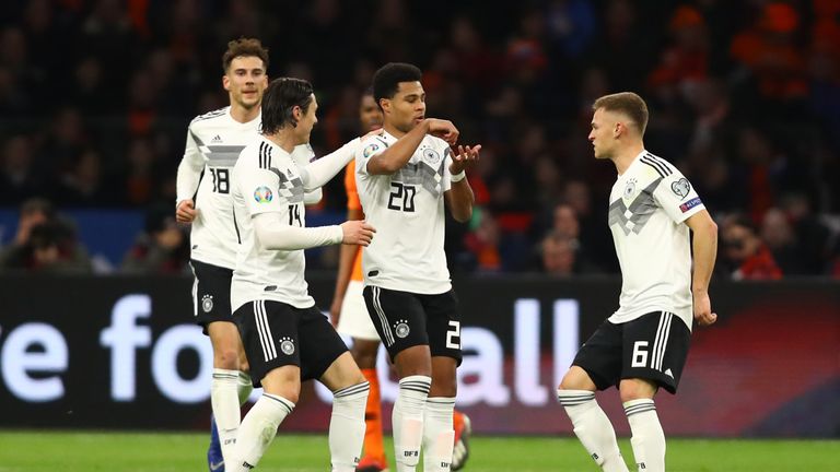 Serge Gnabry of Germany (20) celebrates after scoring his team's second goal with team mates during the 2020 UEFA European Championships Group C qualifying match between Netherlands and Germany at Johan Cruyff Arena on March 24, 2019 in Amsterdam, Netherlands