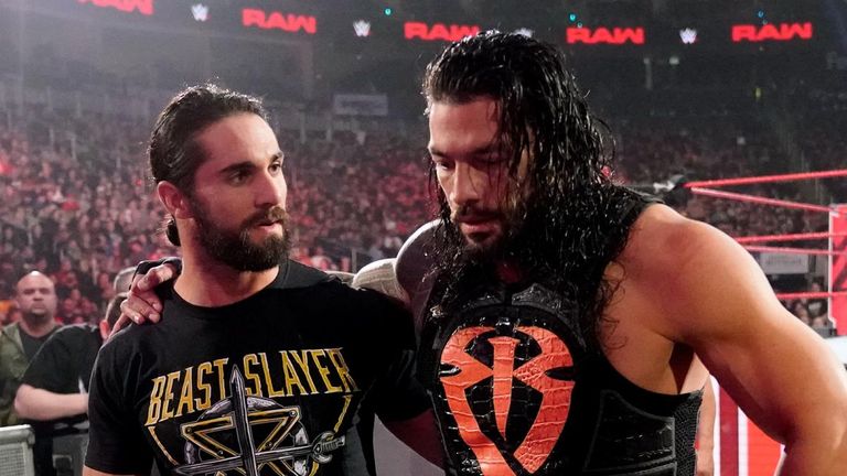 Seth Rollins helped Roman Reigns from ringside after he was assaulted by Drew McIntyre