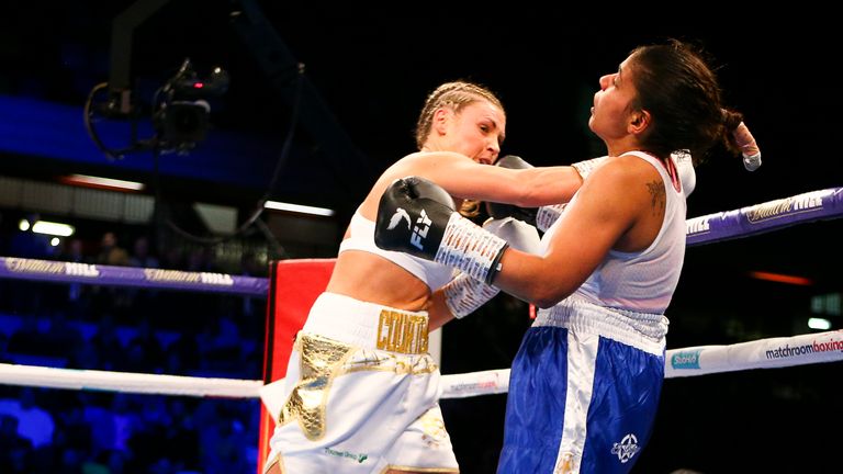 Shannon Courney lands a right hand on Cristina Busioc
