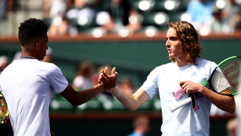 Stefanos Tsitsipas of Greece shakes hands at the net after his straight sets defeat against Felix Auger-Aliassime of Canadaduring their men's singles second round match on day six of the BNP Paribas Open at the Indian Wells Tennis Garden on March 09, 2019 in Indian Wells, California.