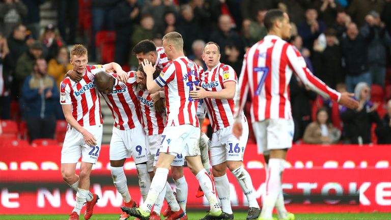 Stoke City&#39;s Benik Afobe (second left) celebrates scoring his side&#39;s second goal of the game with team mates