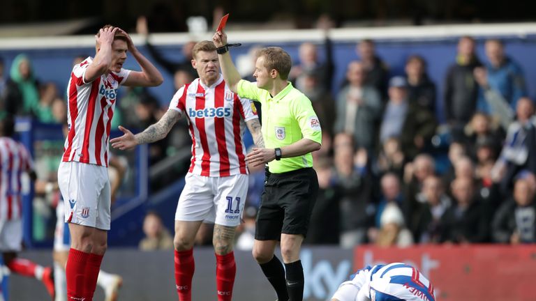 Stoke City's Sam Clucas receives a red card from match referee Gavin Ward