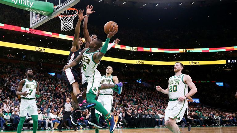 Terry Rozier of the Boston Celtics takes a shot against Bradley Beal of the Washington Wizards