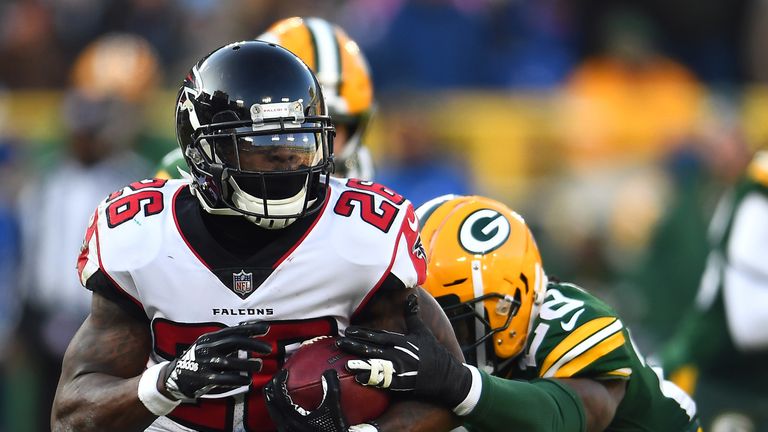 Tevin Coleman breaks a tackle versus the Packers