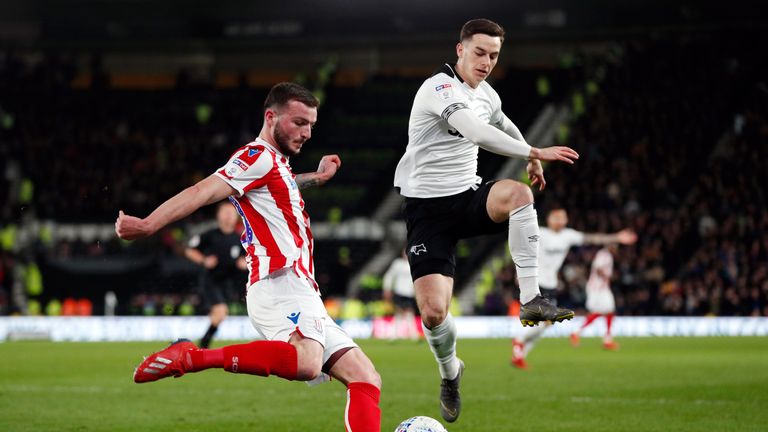 Stoke City's Tom Edwards (left) and Derby County's Tom Lawrence battle for the ball