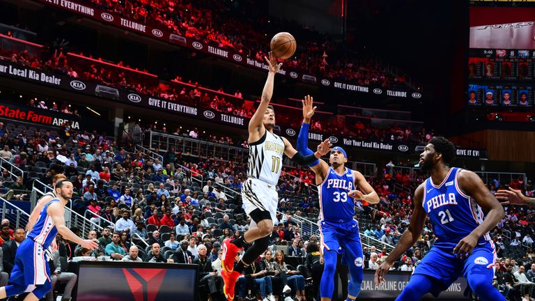 Trae Young #11 of the Atlanta Hawks shoots the ball against the Philadelphia 76ers on March 23, 2019 at State Farm Arena in Atlanta, Georgia.