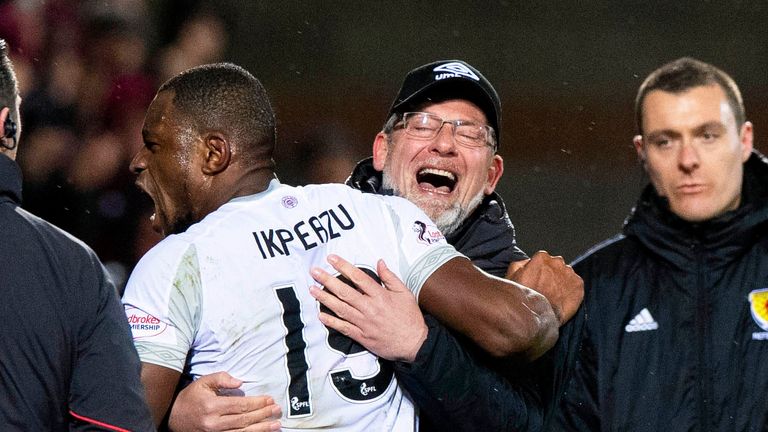 Hearts' Uche Ikpeazu celebrates with manager Craig Levein 