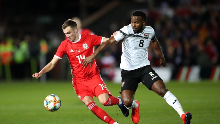 Wales' Ryan Hedges (left) and Trinidad and Tobago's Khaleem Hyland battle for the ball 