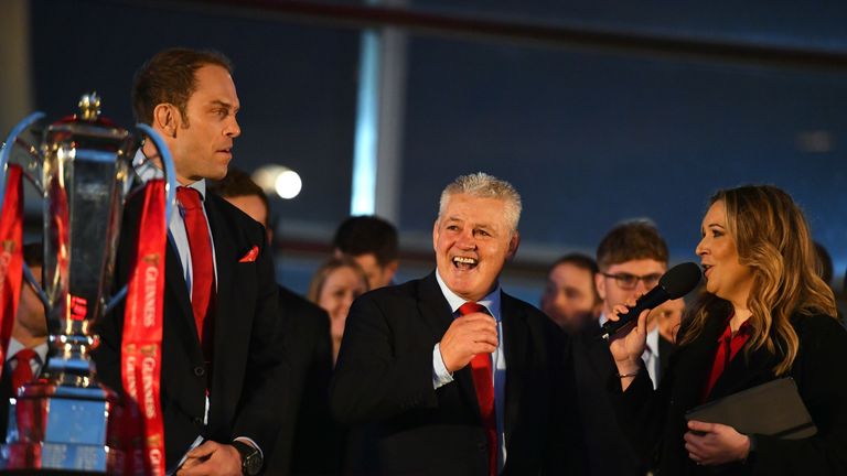 Sports journalist Catrin Heledd (right) with Wales captain Alun Wyn Jones (left) and head coach Warren Gatland during the 2019 Guinness Six Nations Grand Slam winners celebration welcome at the Senedd in Cardiff Bay, 18 March 2019