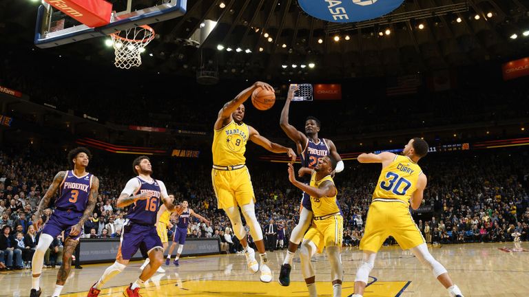 Andre Iguodala of the Golden State Warriors rebounds the ball against the Phoenix Suns