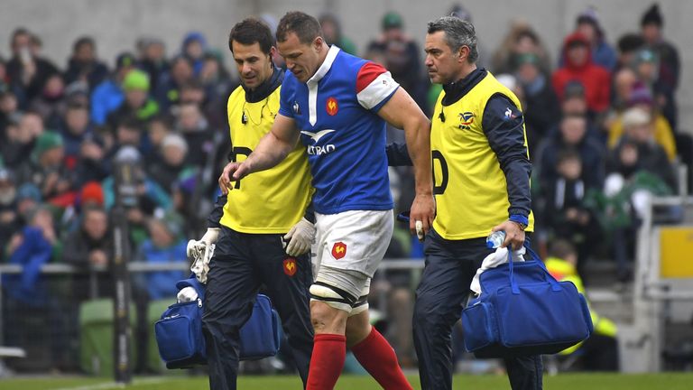 Wenceslas Lauret (C) is helped from the pitch at the Aviva Stadium after picking up an injury