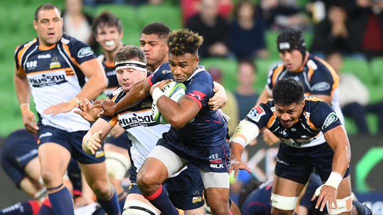  Will Genia of the Rebels breaks free of a tackle 